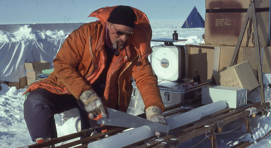 Henrik B. Clausen on the Renland ice cap in 1988; cutting a freshly drilled ice core.